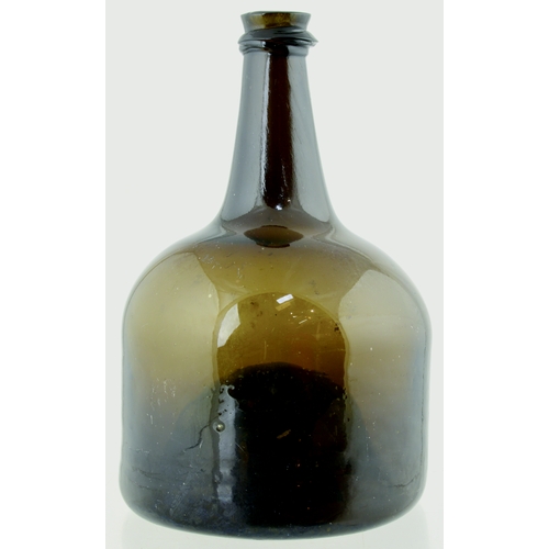 703 - ENGLISH MALLET STYLE WINE BOTTLE. 8ins tall. Unusual amber/ brown glass, c. 1740-45, tapering neck, ... 