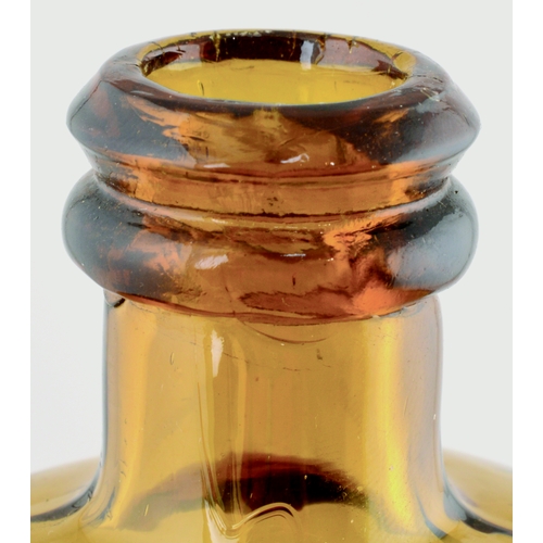 709 - BITTERS BOTTLE. 7ins tall. Slightly flattened rectangular shape, rounded shoulders, amber glass with... 