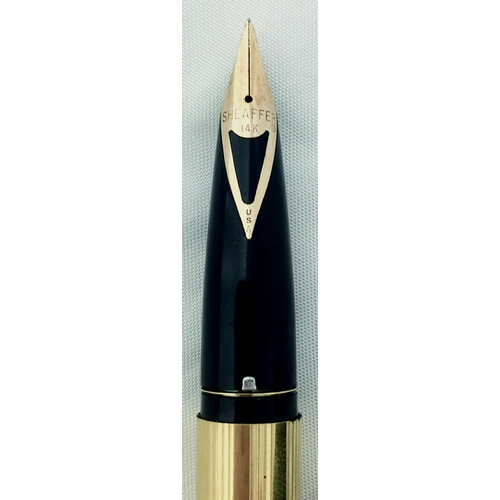 69 - SHEAFFER’S TOUCHDOWN GOLD FOUNTAIN PEN. Gold plated, with a Touchdown filling system. 14k fine nib. ... 