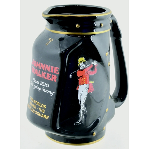 21 - GOLF CADDY SHAPED JOHNNIE WALKER PUB JUG. 5.5ins, black body, handled, bright pictorial JW motif & l... 