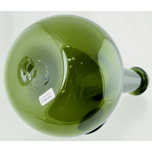 128 - SHAFT & GLOBE SHAPE C.1650 WINE BOTTLE. 9.5ins tall. Green glass, elongated neck with bulbous lower ... 