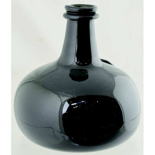 129 - CLASSIC ONION WINE BOTTLE. 5.5ins tall. Very dark, almost black glass squat onion wine bottle, front... 