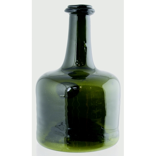 130 - MALLET WINE BOTTLE. 7.5ins tall. Green glass, classic mallet shape with crude body ripples, front se... 