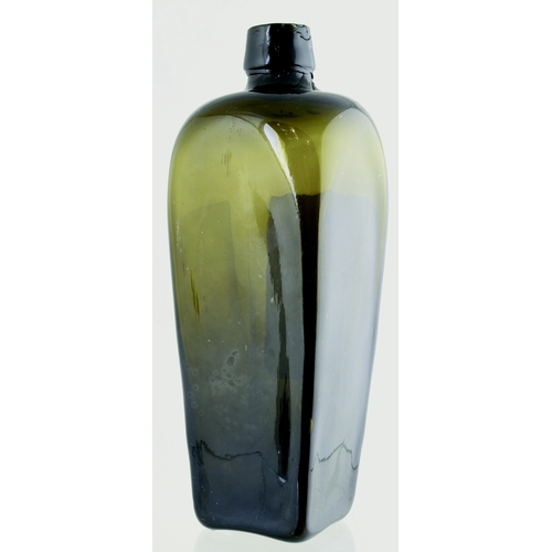 133 - ARBROATH LABELLED GIN BOTTLE. 9ins tall. Olive green glass, applied squat blob lip, original paper l... 