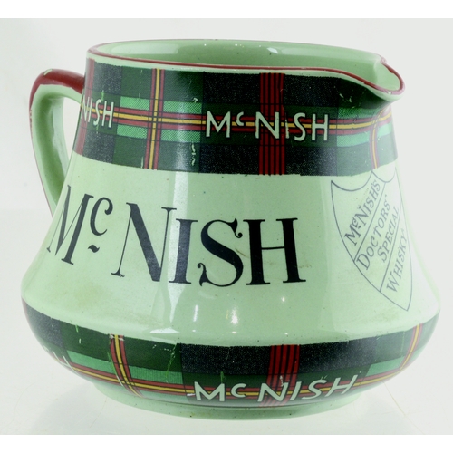 134 - MCNISH WHISKY WATER JUG. 4ins tall. Squat shape jug, rare handle pale green glaze with tartan detail... 