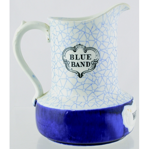 11 - WATSON’S WHISKY WATER JUG. 6.75ins tall. Decorated blue & white design, with solid blue band below, ... 