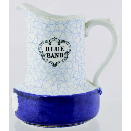 11 - WATSON’S WHISKY WATER JUG. 6.75ins tall. Decorated blue & white design, with solid blue band below, ... 