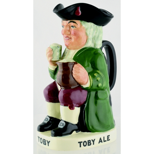 29 - ROYAL DOULTON TOBY JUG. 9.5ins tall. Jug formed as a seated toby TOBY ALE in black lettering to plin... 