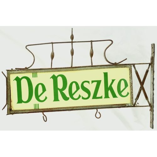 70 - DE RESZKE HANGING ENAMEL SHOP SIGN. 22ins across. Double sided enamel sign within wrought iron surro... 