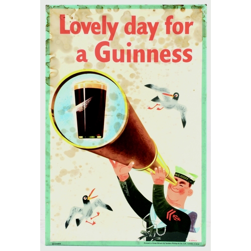 76 - GUINNESS LAMINATED TIN ON CARD ADVERT. 12 by 8ins. Multicoloured nautical image of sailor looking th... 