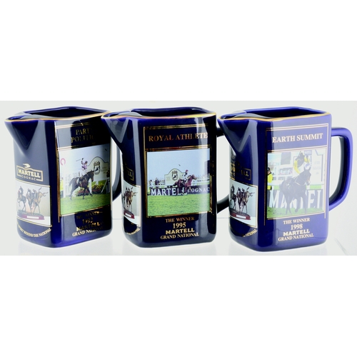 79 - LIMITED EDITION MARTELL GRAND NATIONAL JUGS GROUP. 6ins tall. All dark blue glaze with various winne... 