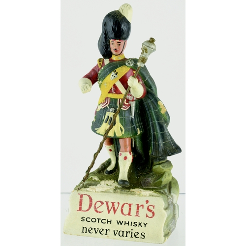 83 - DEWAR’S SCOTCH WHISKY BACK BAR FIGURE. 9.5ins tall. Rubberoid figure of kilted gent, staff in hand s... 