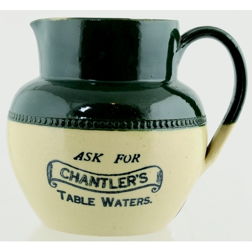 121 - CHANTLER’S TABLE
WATERS JUG. 4.25ins tall,
stoneware. Dark green top,
lower off white glaze,
black t... 