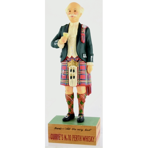 123 - CURRIE’S PERTH WHISKY BACK BAR FIGURE. 13.5ins tall. Kilted Scotsman with drink in hand rubberoid fi... 