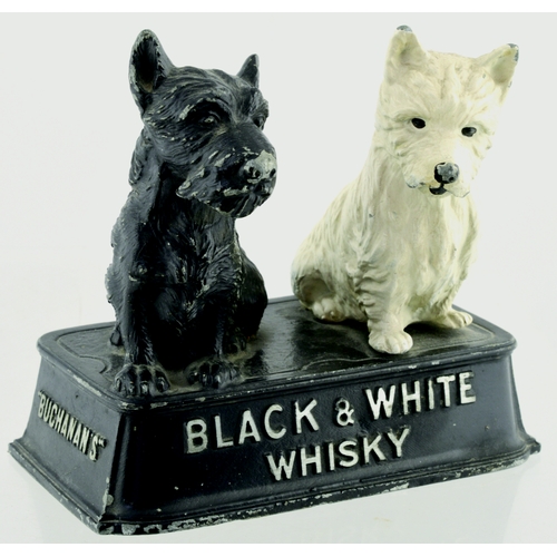 127 - BLACK & WHITE WHISKY BACK BAR FIGURE. 5.5ins tall. Cast metal construction of black & white Scottie ... 