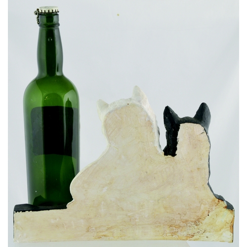 128 - BACK BAR FIGURE. 8.5ins tall. Plaster figure of seated black & white Scottie dogs, area to one side ... 