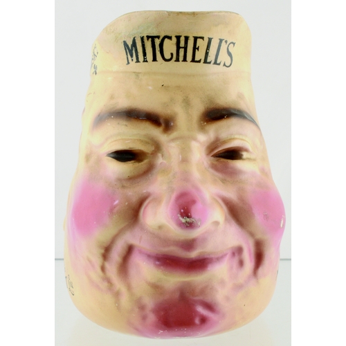 158 - BELFAST MITCHELLS OLD IRISH WHISKY HEAD JUG. 6.25ins tall. Character Jug in form of smiling head, ad... 