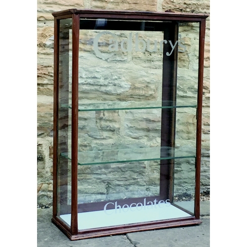 160 - CADBURY’S CHOCOLATE SHOP DISPLAY CABINET. 29.5 by 19 by 9ins. Wooden cabinet with 2 glass shelves, r... 