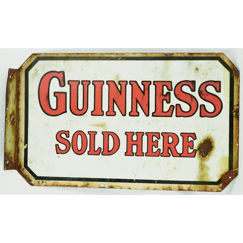 166 - GUINNESS DOUBLE SIDED ENAMEL SIGN. 18 by 11ins. Lozenge shape enamel sign GUINNESS/ SOLD HERE. Overa... 