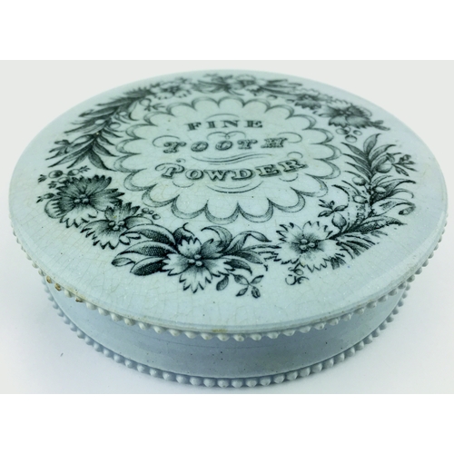 22 - FINE TOOTH POWDER POT LID &
BASE. (APL, p 144, 107) 3.75ins diam. Pale
blue glaze, black transfer wi... 