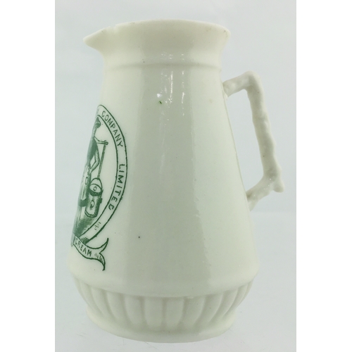 46 - BELGRAVIA DAIRY COMPANY CHINA CREAM JUG. 3.5ins tall. Green transfer, printed with milkmaid, yoke an... 