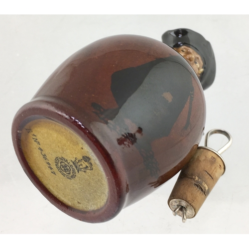 62 - MINIATURE KINGSWARE FLASK. 4.5ins tall to top of stopper. Kingsware flask modelled as The
Watchman. ... 