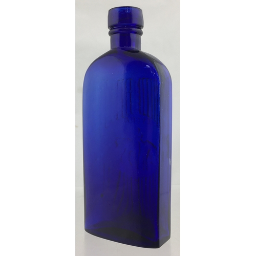 63 - CYONA POISON BOTTLE. (DP pg 108) 5.75ins tall, cobalt blue glass round shouldered rectangular shape ... 