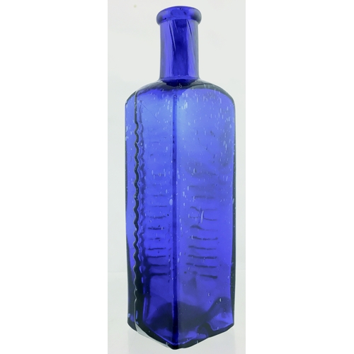 64 - ETON STAR POISON BOTTLE. (DP pg 58) 6.75ins tall. 16oz, cobalt blue glass, star section with flat ba... 