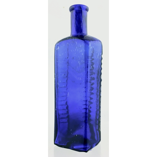 64 - ETON STAR POISON BOTTLE. (DP pg 58) 6.75ins tall. 16oz, cobalt blue glass, star section with flat ba... 