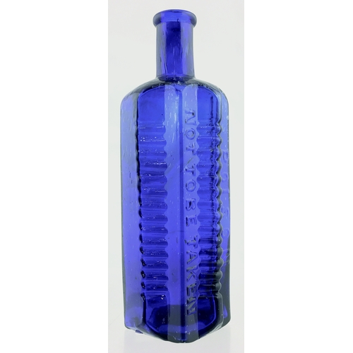 64 - ETON STAR POISON BOTTLE. (DP pg 58) 6.75ins tall. 16oz, cobalt blue glass, star section with flat ba... 