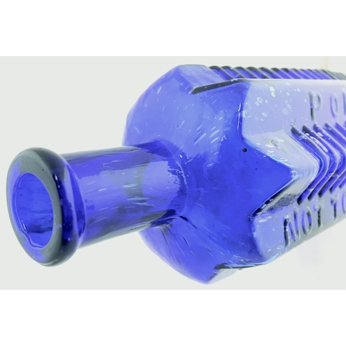 64 - ETON STAR POISON BOTTLE. (DP pg 58) 6.75ins tall. 16oz, cobalt blue glass, star section with flat ba... 