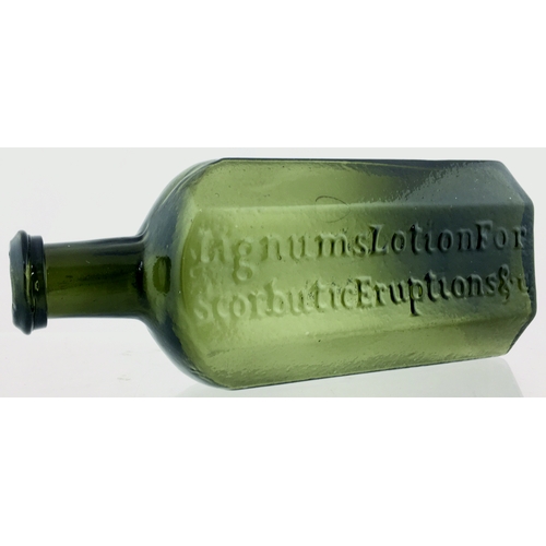 71 - LIGNUMS EARLY MEDICINE BOTTLE.
7ins tall, variating light olive green glass,
flattened octagonal sha... 