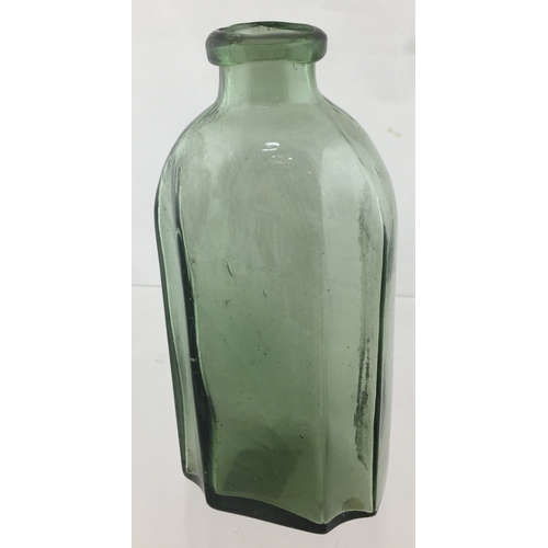 74 - PONTILLED UTILITY BOTTLE. 6ins tall. Variating
smokey aqua glass, rectangular form, rounded shoulder... 