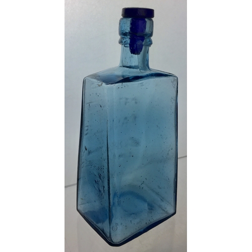 80 - PRICES PATENT CANDLE CO BOTTLE. 7.5ins tall, to top of stopper. Ice blue glass. Classic wedge shape ... 