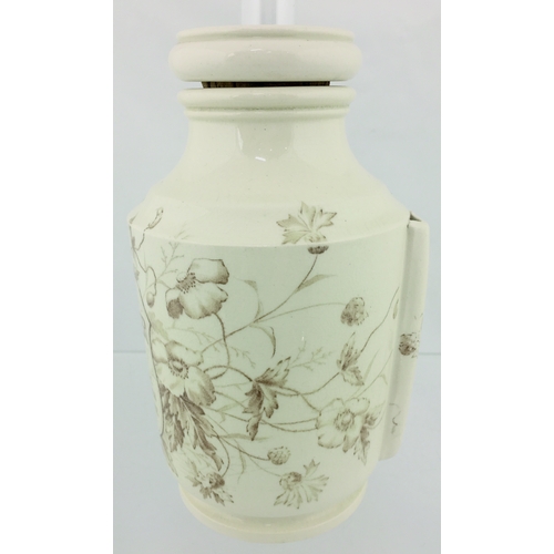 84 - THE WESTMINSTER INHALER. 6.25ins tall to top of lid. Cream glaze, all over brown floral decoration T... 