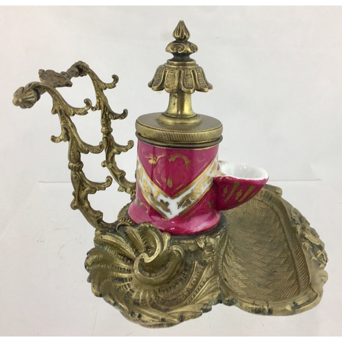 89 - TEAKETTLE INK. 5ins tall. Ceramic
teakettle style ink set within elaborate brass stand. Ink has pink... 