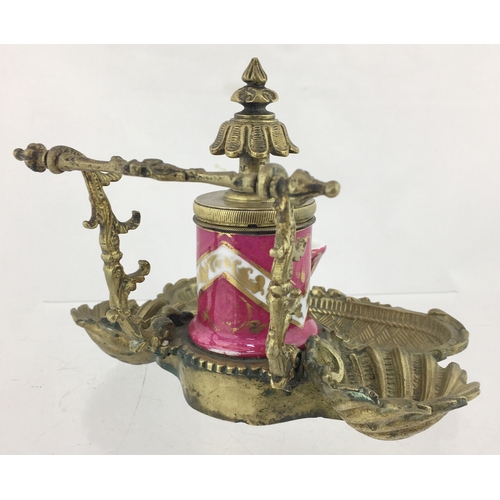 89 - TEAKETTLE INK. 5ins tall. Ceramic
teakettle style ink set within elaborate brass stand. Ink has pink... 