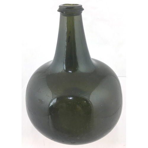 112 - DATED ONION WINE BOTTLE. 6.75ins
tall. Very dark green glass, tapering neck with
thin, pointed edge ... 