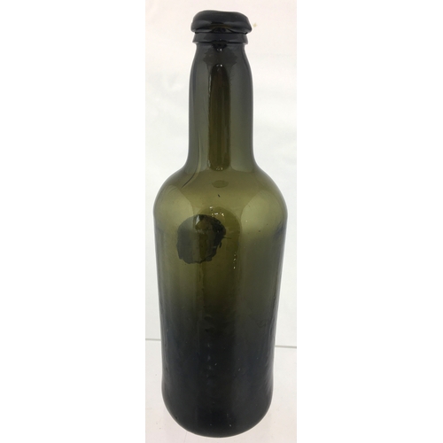 116 - SEALED CYLINDER WINE BOTTLE. 11ins tall.
Variating green glass, rounded shoulders, applied seal MAG ... 