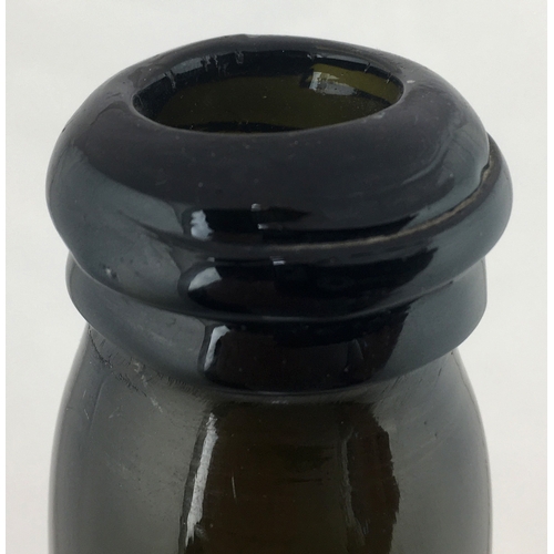 116 - SEALED CYLINDER WINE BOTTLE. 11ins tall.
Variating green glass, rounded shoulders, applied seal MAG ... 