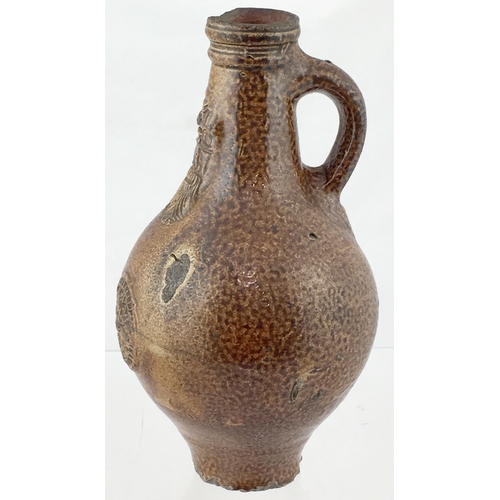 122 - BELLARMINE JUG. 8.5ins tall. Fabulous variating tiger glaze, bulbous bodied bellarmine jug, bearded ... 