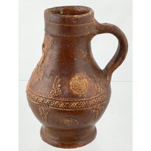 123 - BELLARMINE JUG. 5.75ins tall. All over tan glaze, bulbous bodied bellarmine jug, bearded face below ... 