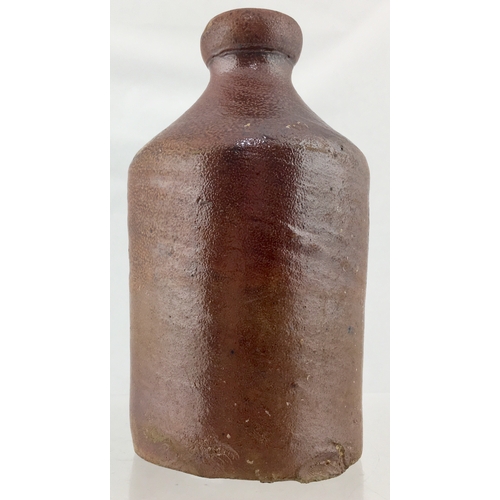 124 - WARRENS BLACKING BOTTLE. 5.5ins tall. Highly variating tan salt glaze cylindrical bottle shape. Very... 