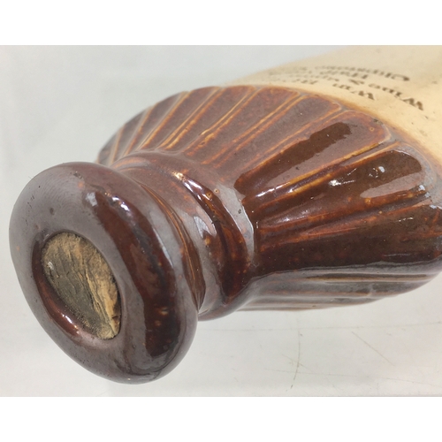 127 - LONDON SPIRIT FLASK. 7ins tall. T.t, salt glaze
dark to the right side, flattened rectangular shape ... 