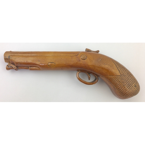 139 - PISTOL FLASK. 12ins long. Tan salt glaze
flask formed as a flintlock pistol with
various scraffitto ... 