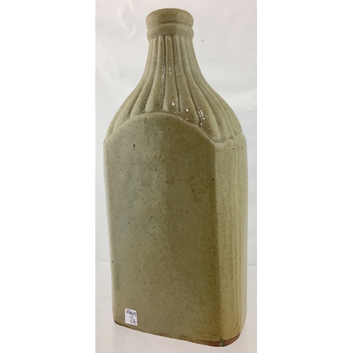 147 - LEICESTER SLAB SEAL SPIRIT FLASK. 9ins tall. Grey/ green slip glaze. Rectangular shape flask, slopin... 