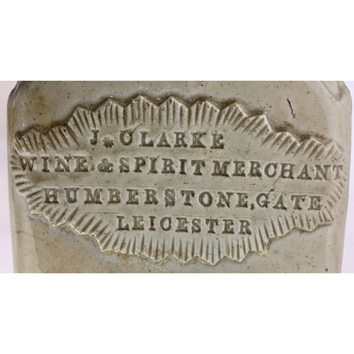 147 - LEICESTER SLAB SEAL SPIRIT FLASK. 9ins tall. Grey/ green slip glaze. Rectangular shape flask, slopin... 