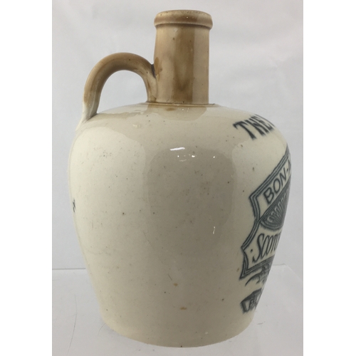 153 - BLACK & FERGUSON WHISKY JUG. (WG p 25) 7.5ins tall. Tan neck, lower off white glaze,
black transfer ... 