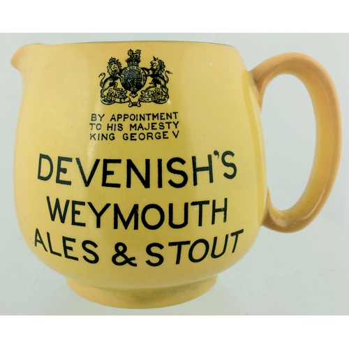 159 - WEYMOUTH PUB JUG. 4ins tall. Bulbous
bodied jug, all over yellow glaze, black transfer
DEVENISH’S/ W... 