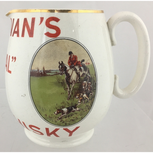 161 - BUCHANAN’S RED SEAL WHISKY
WATER JUG. 5.5ins tall. Bulbous body,
white glaze with BUCHANAN’S/ RED
SE... 